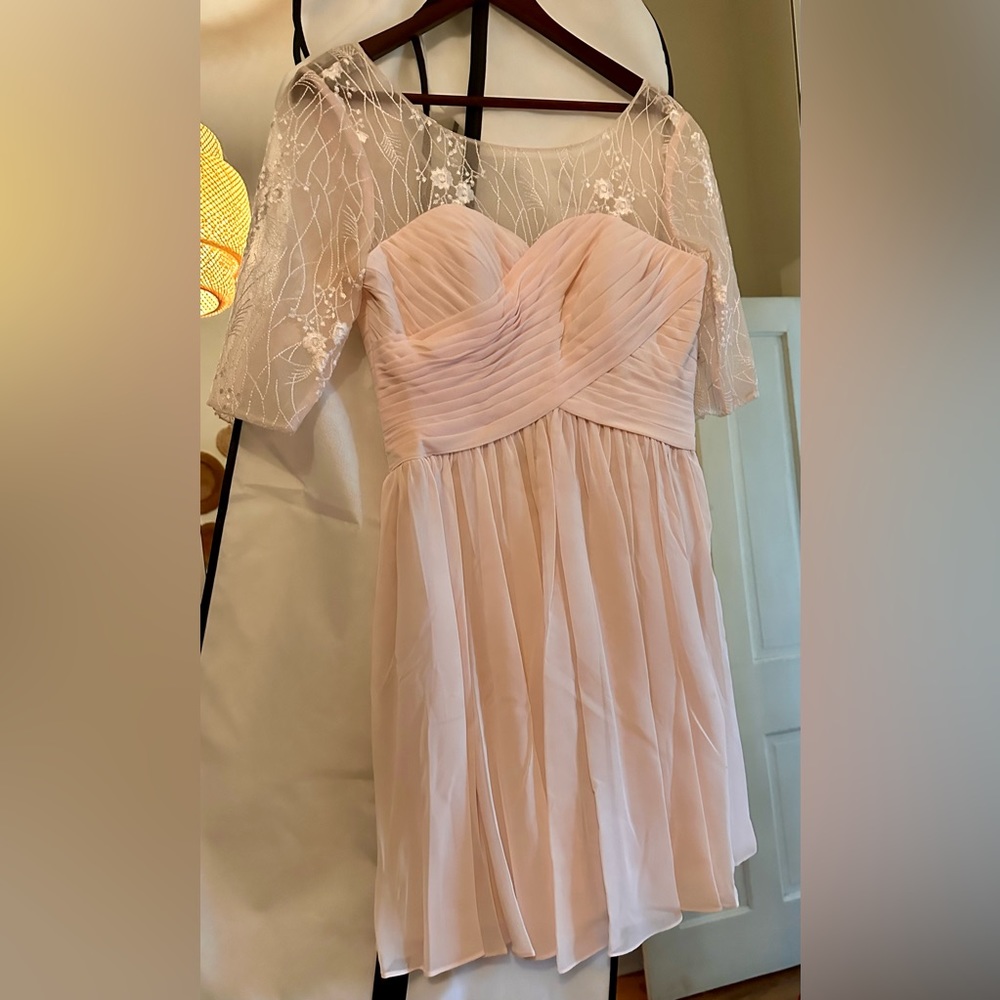 Pale pink knee length bridesmaid dress